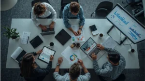 Digital marketing strategist working with a creative team in an office.